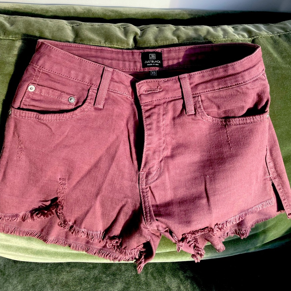 Distressed purple jean shorts with lots of stretch